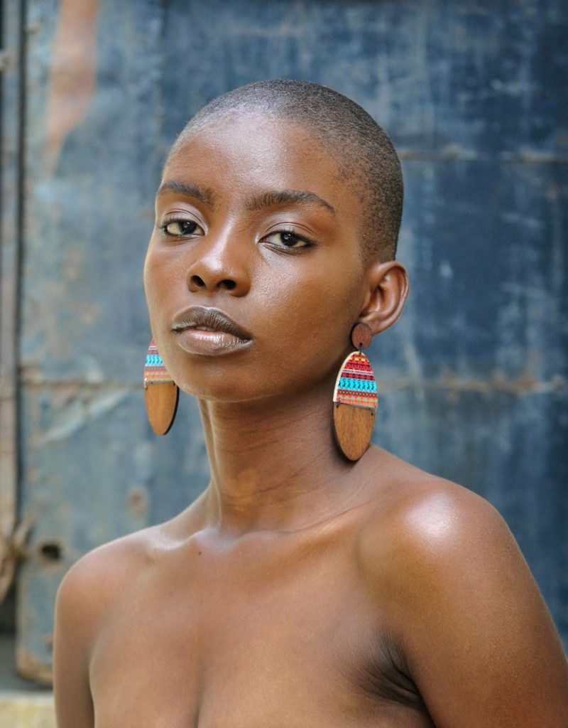 a-beautiful-woman-with-unique-earrings-poses-bfsmznaij8i